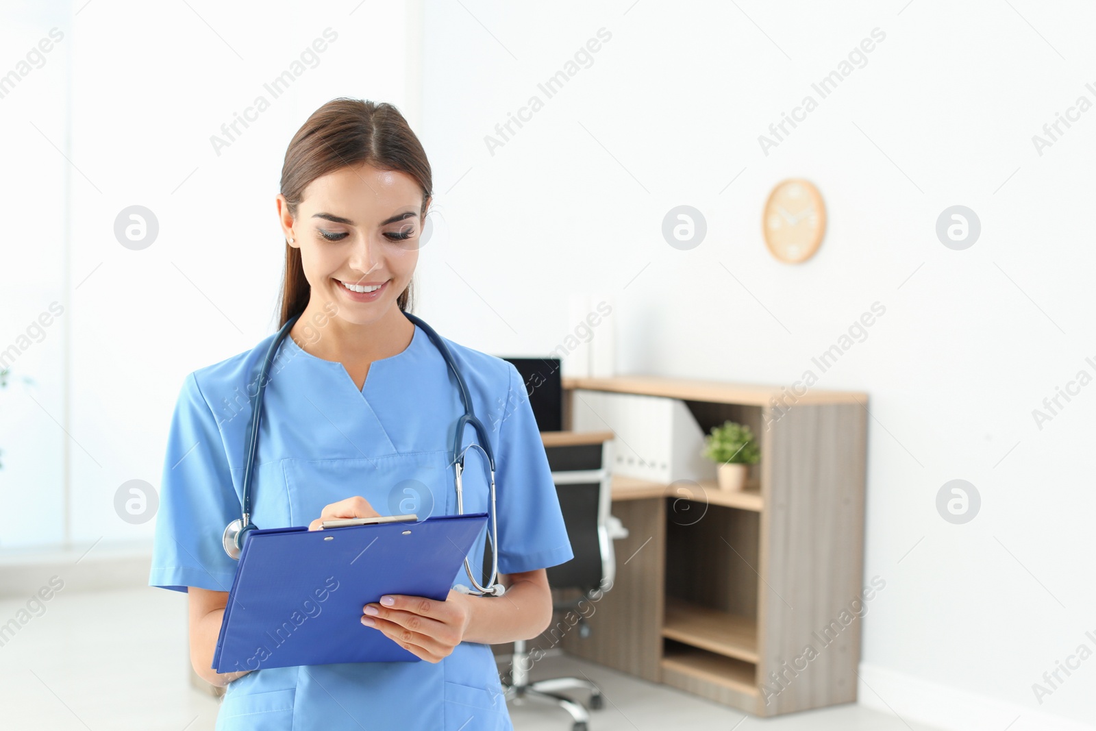 Photo of Female medical assistant in clinic. Health care service