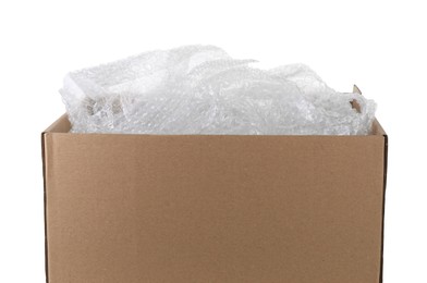 Photo of Transparent bubble wrap in cardboard box isolated on white