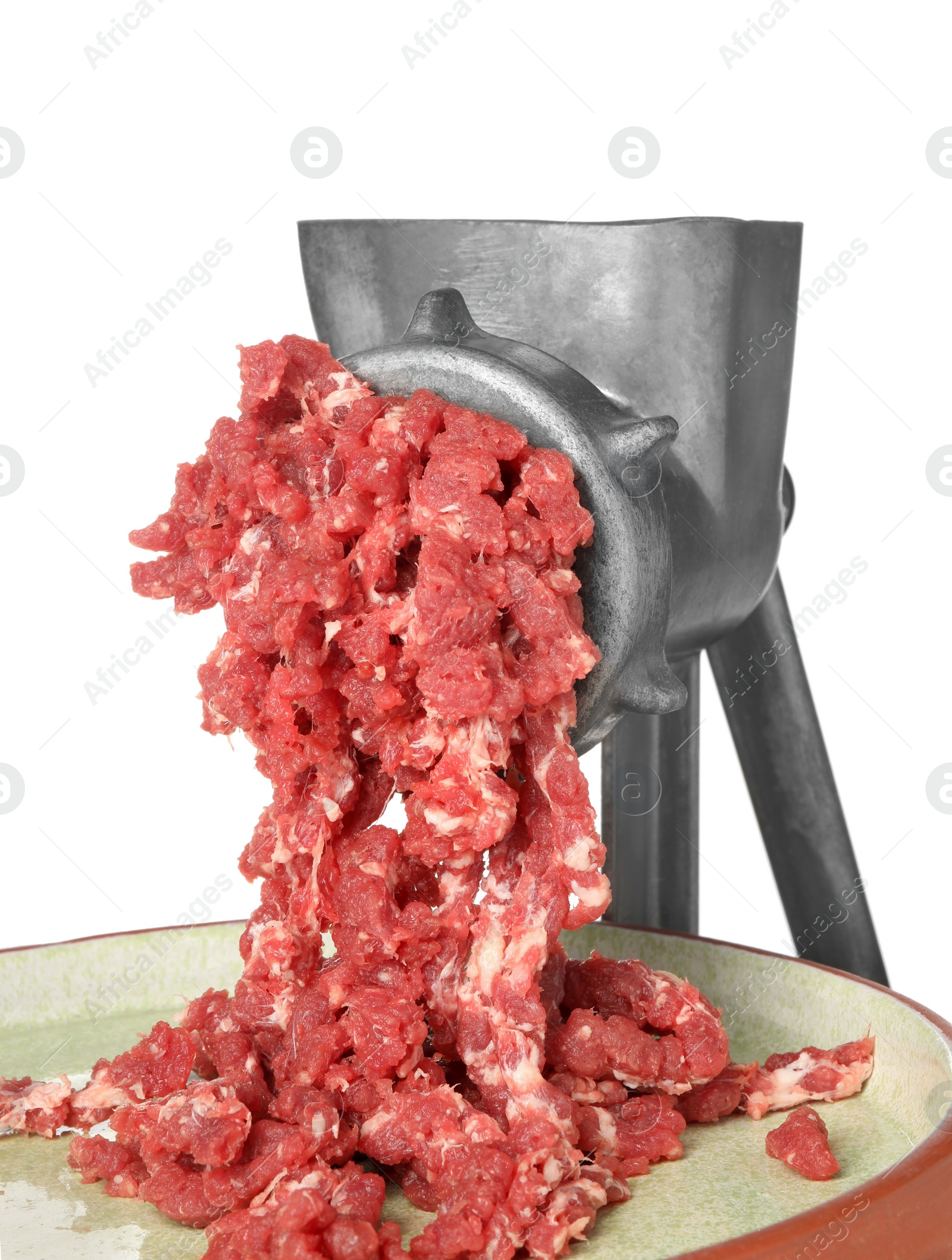 Photo of Metal meat grinder with minced beef and plate isolated on white