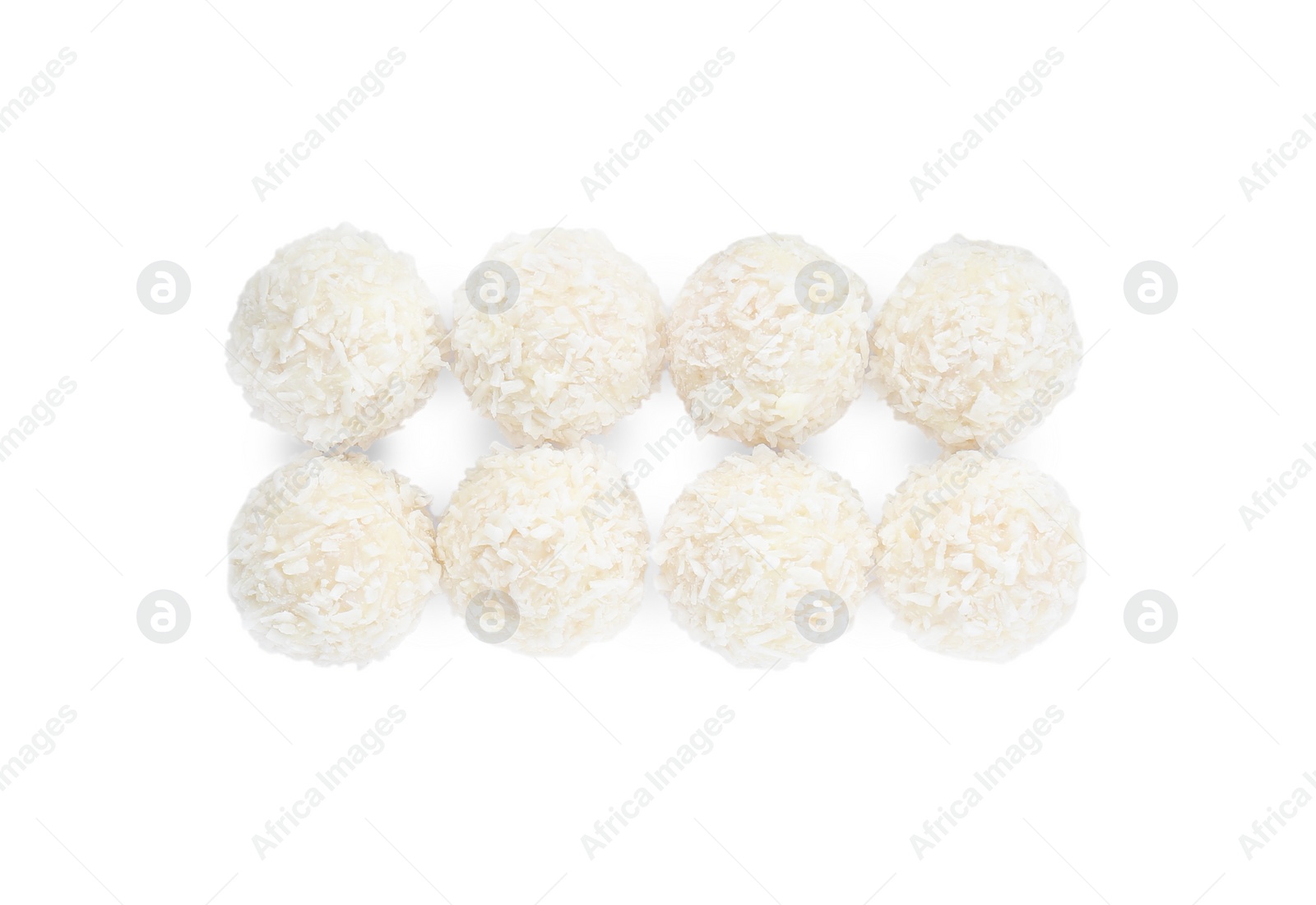 Photo of Tasty coconut balls isolated on white, top view