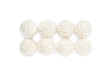 Photo of Tasty coconut balls isolated on white, top view