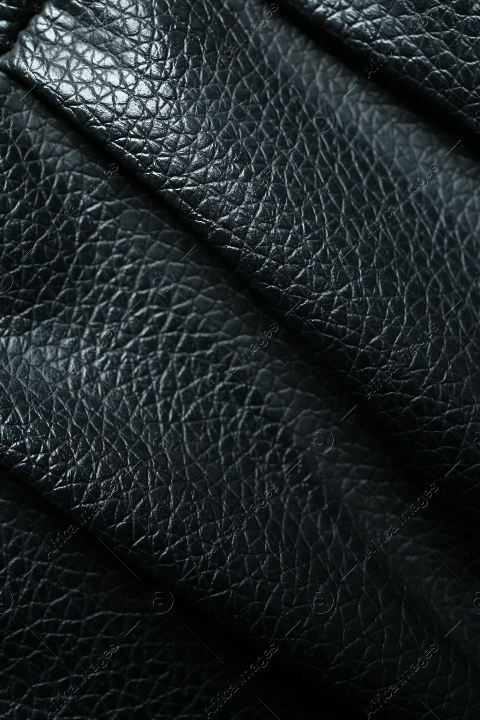 Photo of Black natural leather as background, top view