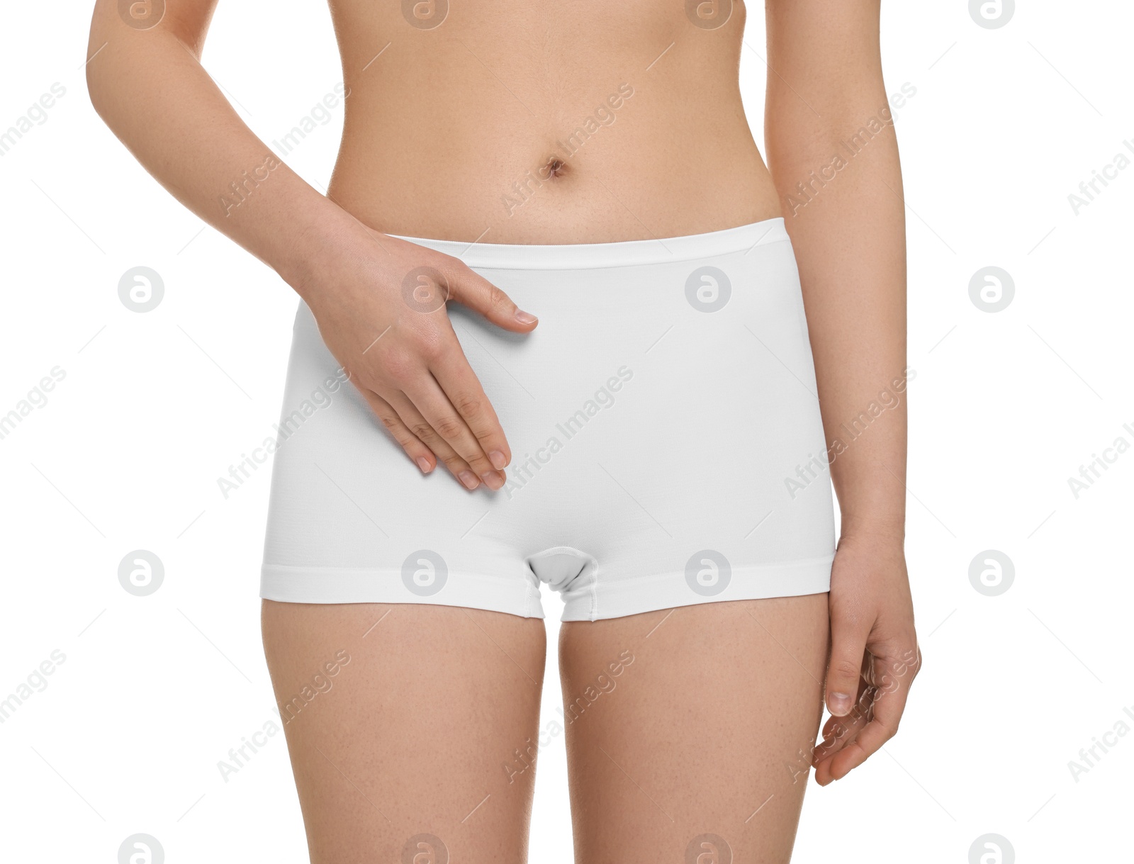 Photo of Woman holding hand near panties on white background, closeup. Women's health