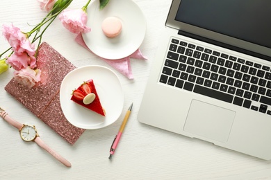 Flat lay composition with laptop on white wooden table. Fashion blogger