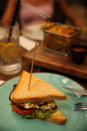 Photo of Delicious sandwich served on plate indoors, closeup