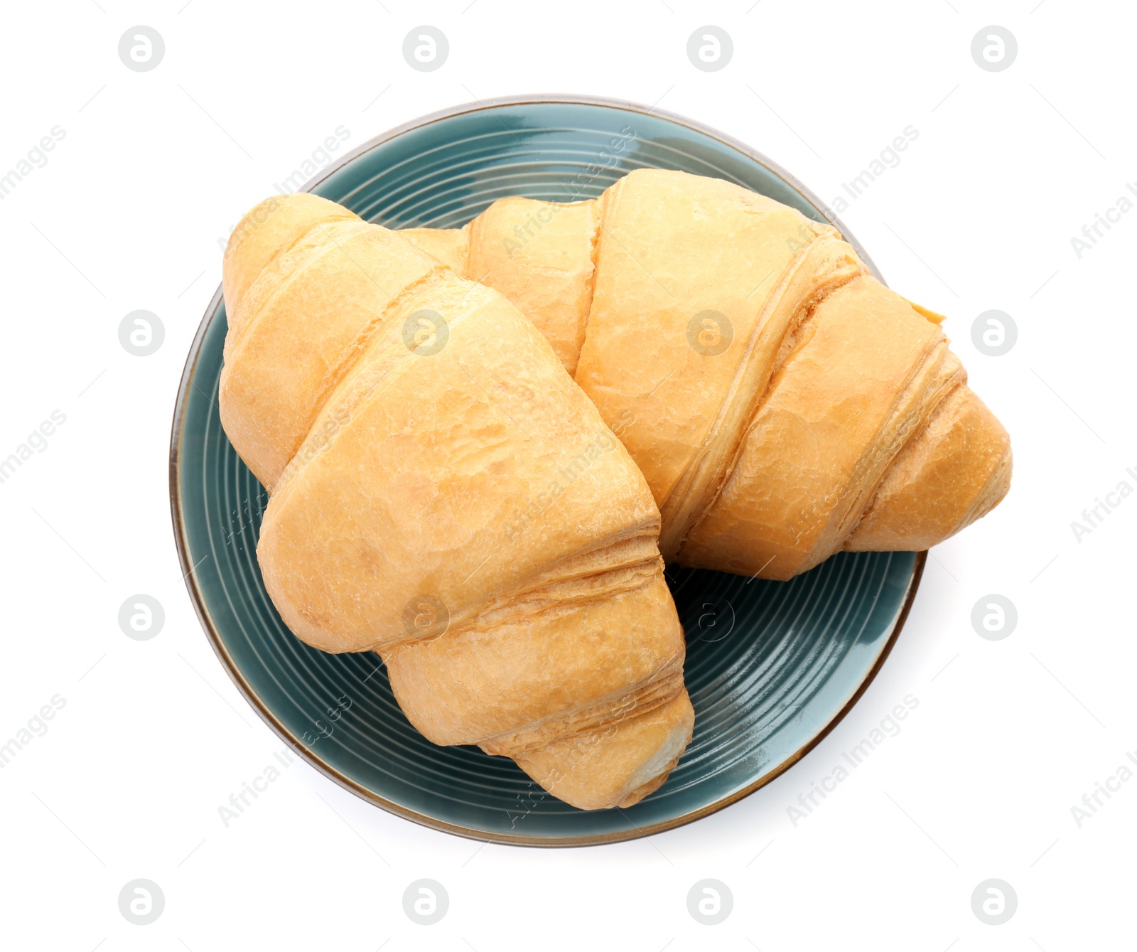 Photo of Tasty croissants on plate against white background, top view