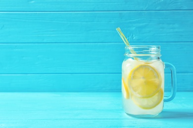 Photo of Natural lemonade in mason jar on wooden table