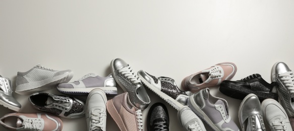 Flat lay composition with stylish shoes on light background. Space for text