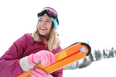 Female skier on slope at resort. Winter vacation