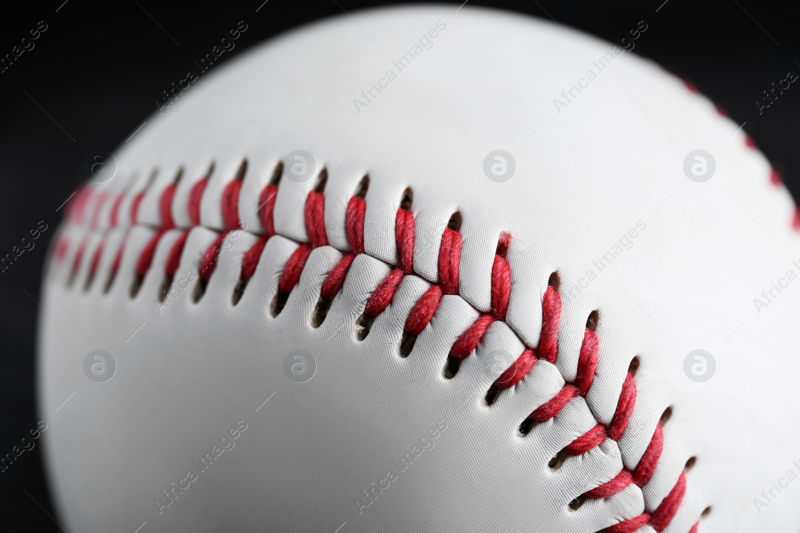 Photo of Baseball ball on black background, closeup. Sports game