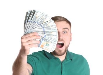 Portrait of young man holding money banknotes on white background