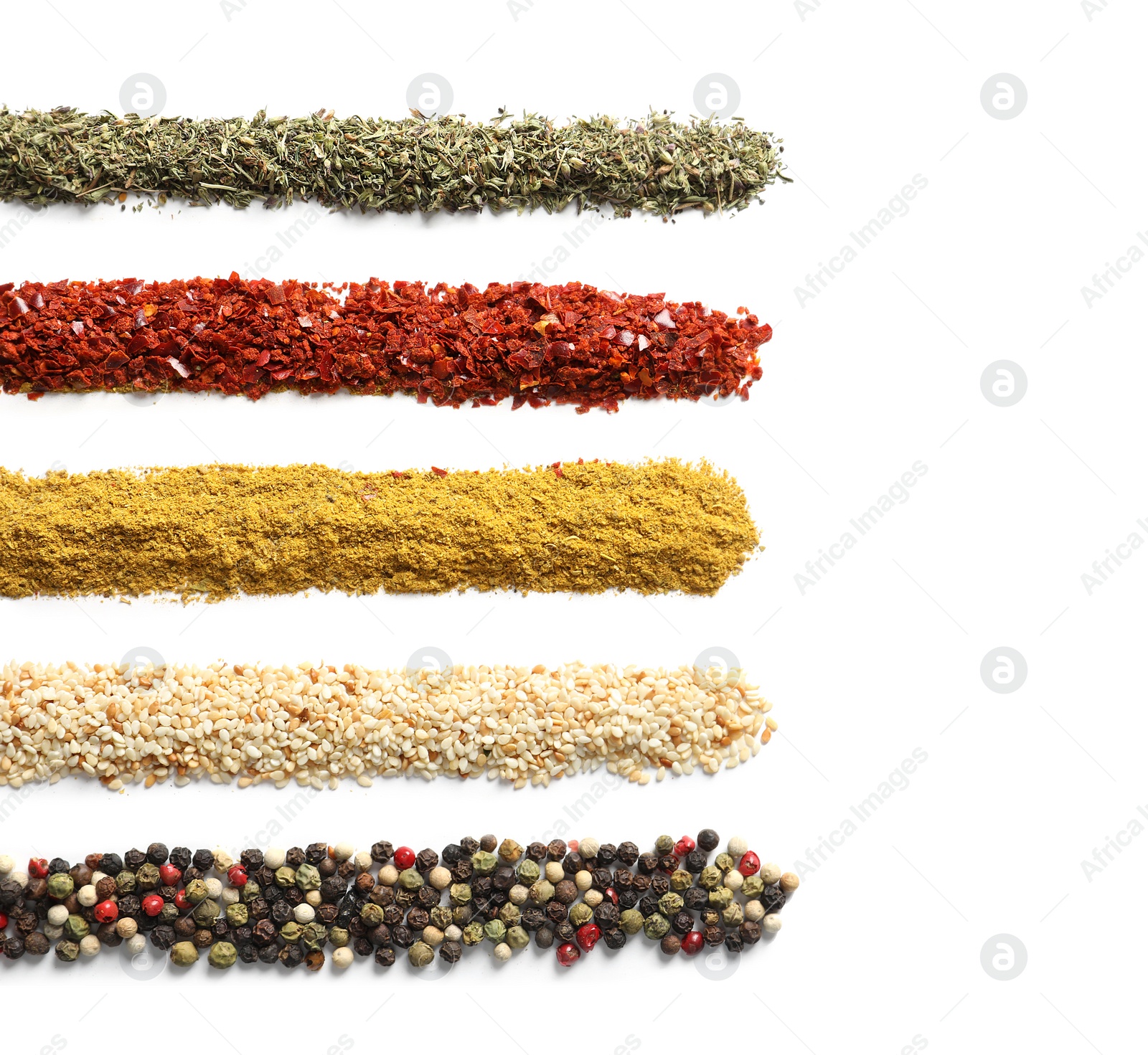 Photo of Rows of different aromatic spices on white background, top view with space for text