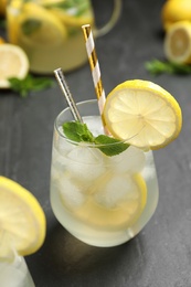 Natural lemonade  with mint on grey table, closeup. Summer refreshing drink