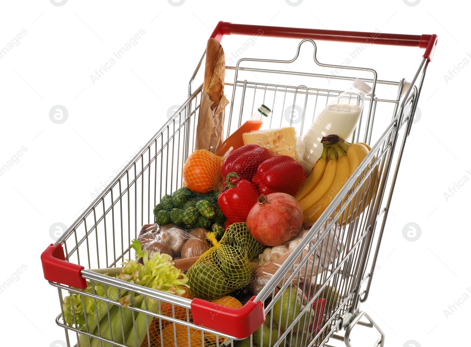 Photo of Shopping cart with fresh groceries on white background