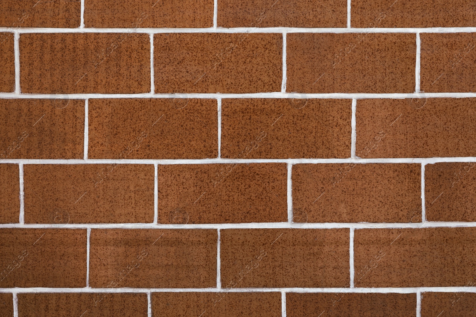 Photo of Texture of brown brick wall as background