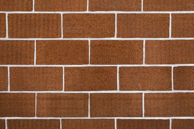 Photo of Texture of brown brick wall as background