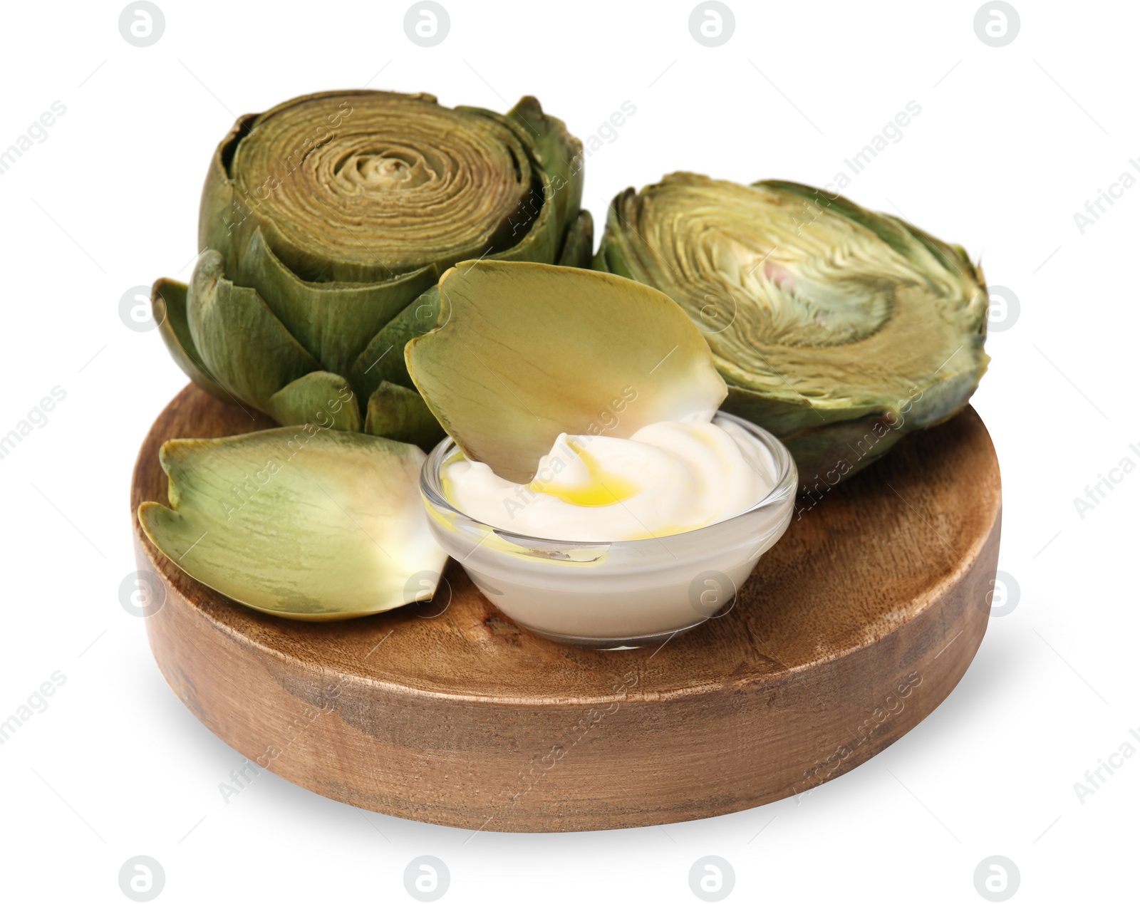 Photo of Delicious cooked artichokes with tasty sauce isolated on white