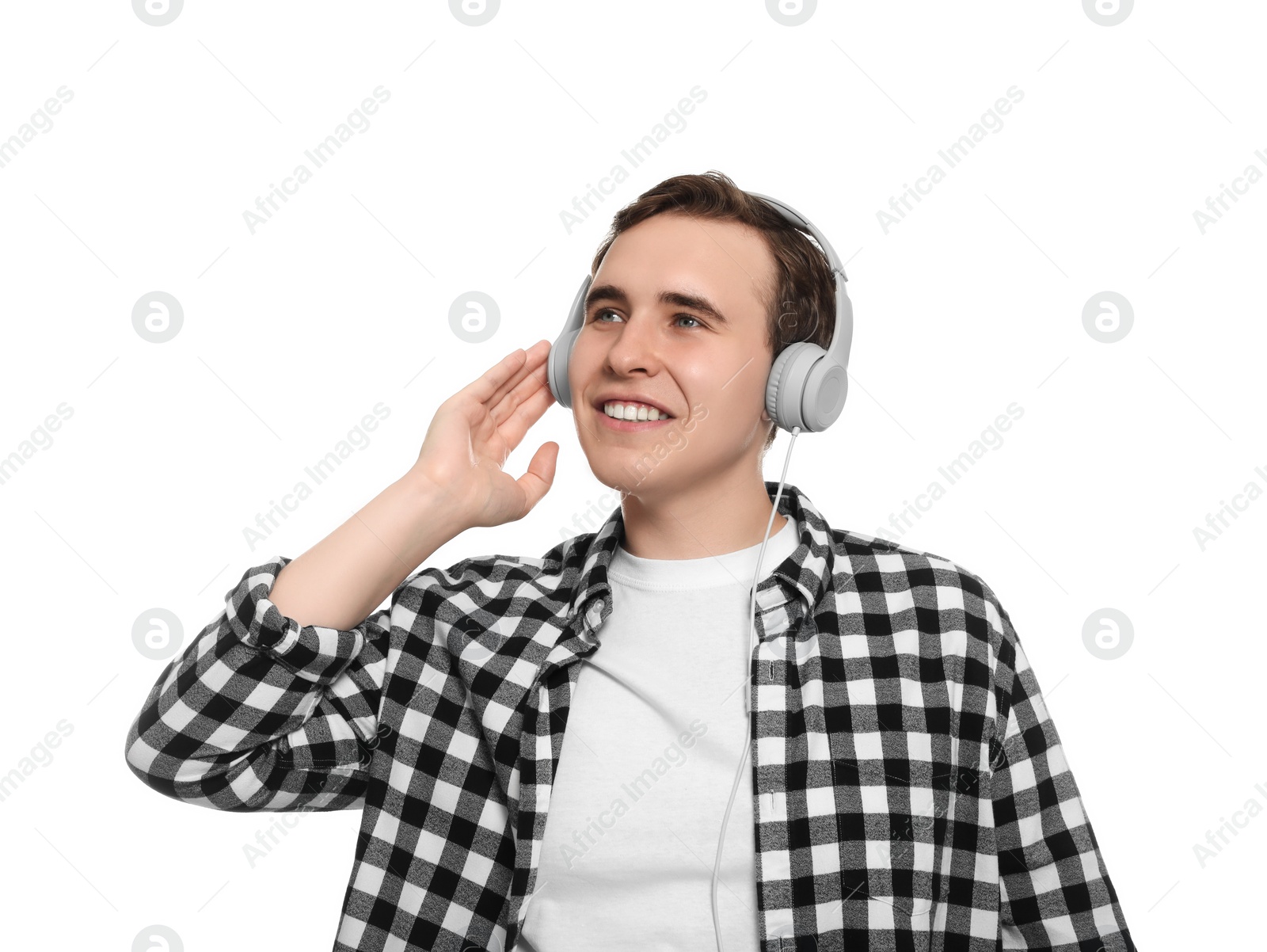 Photo of Handsome young man with headphones on white background