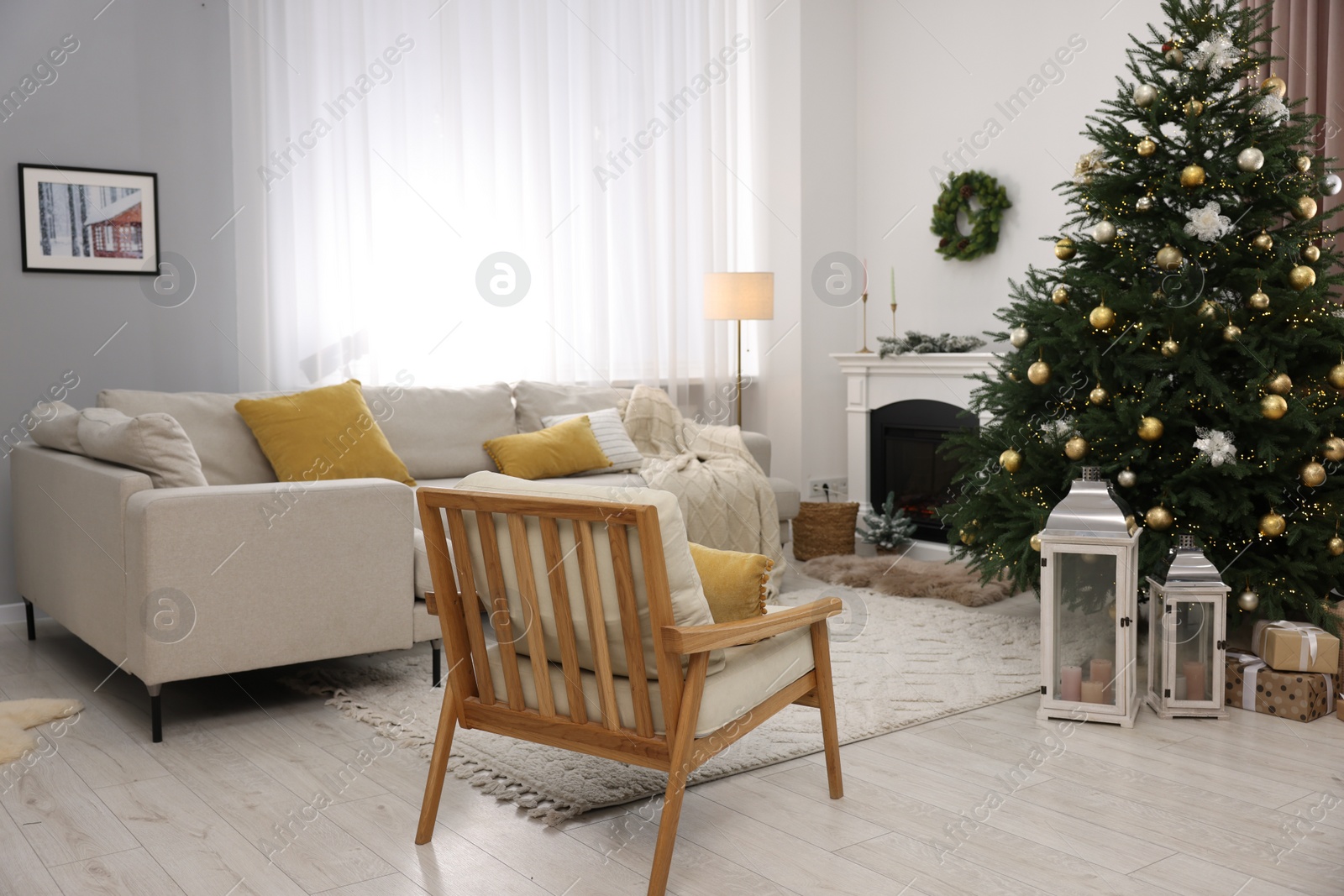 Photo of Christmas tree in furnished living room. Festive interior design