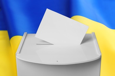 Image of Ballot box with vote against national flag of Ukraine