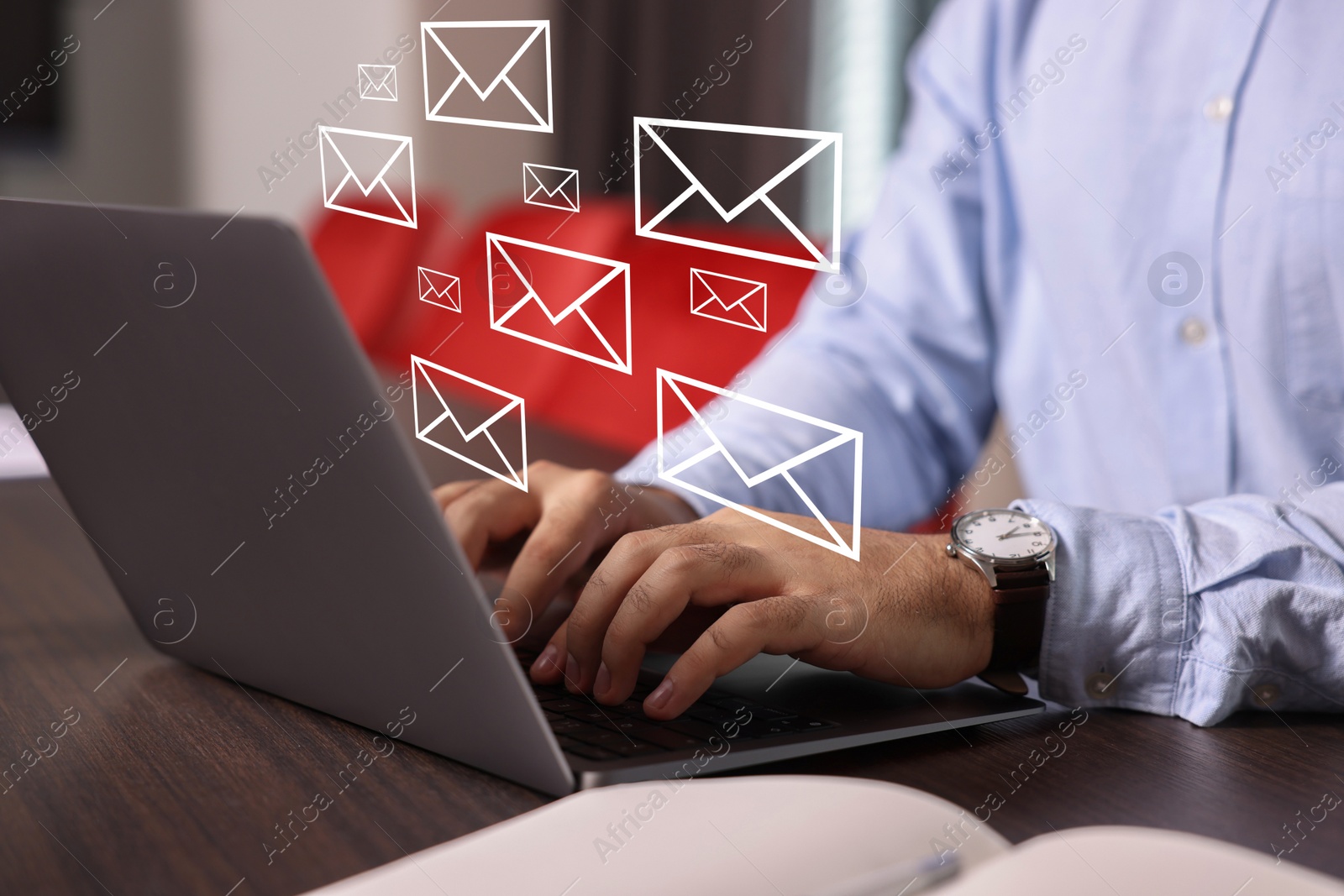 Image of Email. Man using laptop at table, closeup. Letter illustrations over device