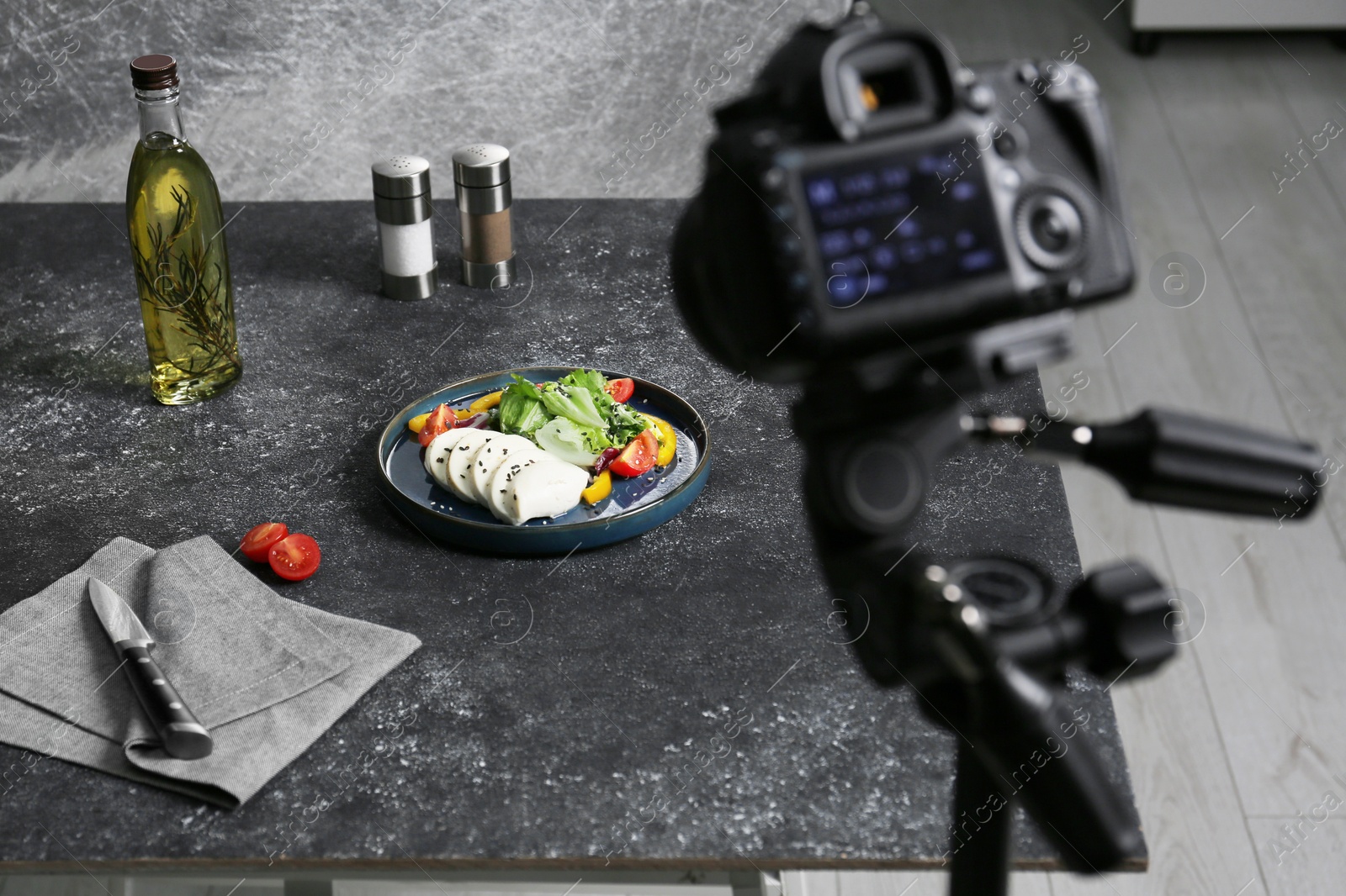 Photo of Composition with mozzarella salad on black table in professional photo studio. Food photography