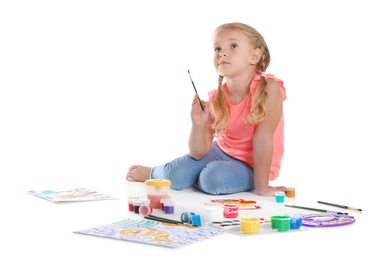 Photo of Cute child painting picture on white background