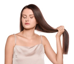 Portrait of beautiful young woman with healthy strong hair on white background