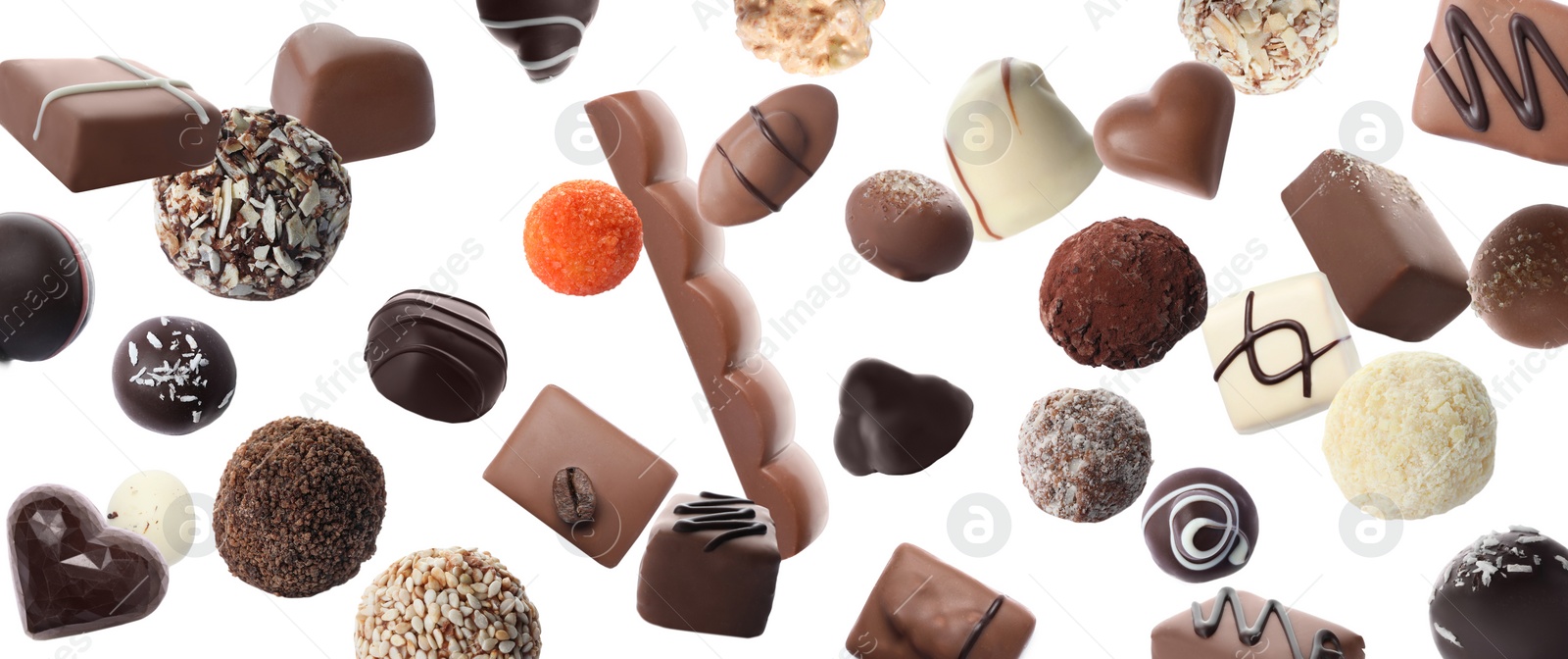 Image of Different chocolate candies falling on white background. Banner design