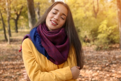 Photo of Portrait of young beautiful woman in park. Autumn walk