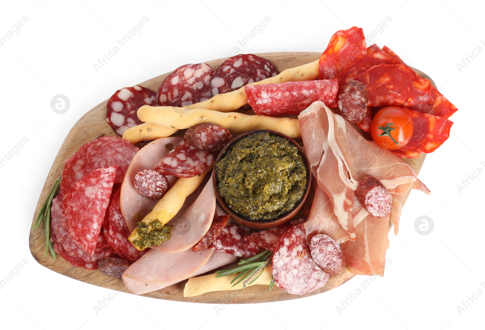 Photo of Wooden board with tasty ham and other delicacies isolated on white, top view