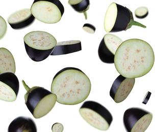 Image of Cut fresh eggplant pieces falling on white background