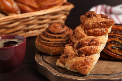 Photo of Different tasty freshly baked pastries on table, closeup