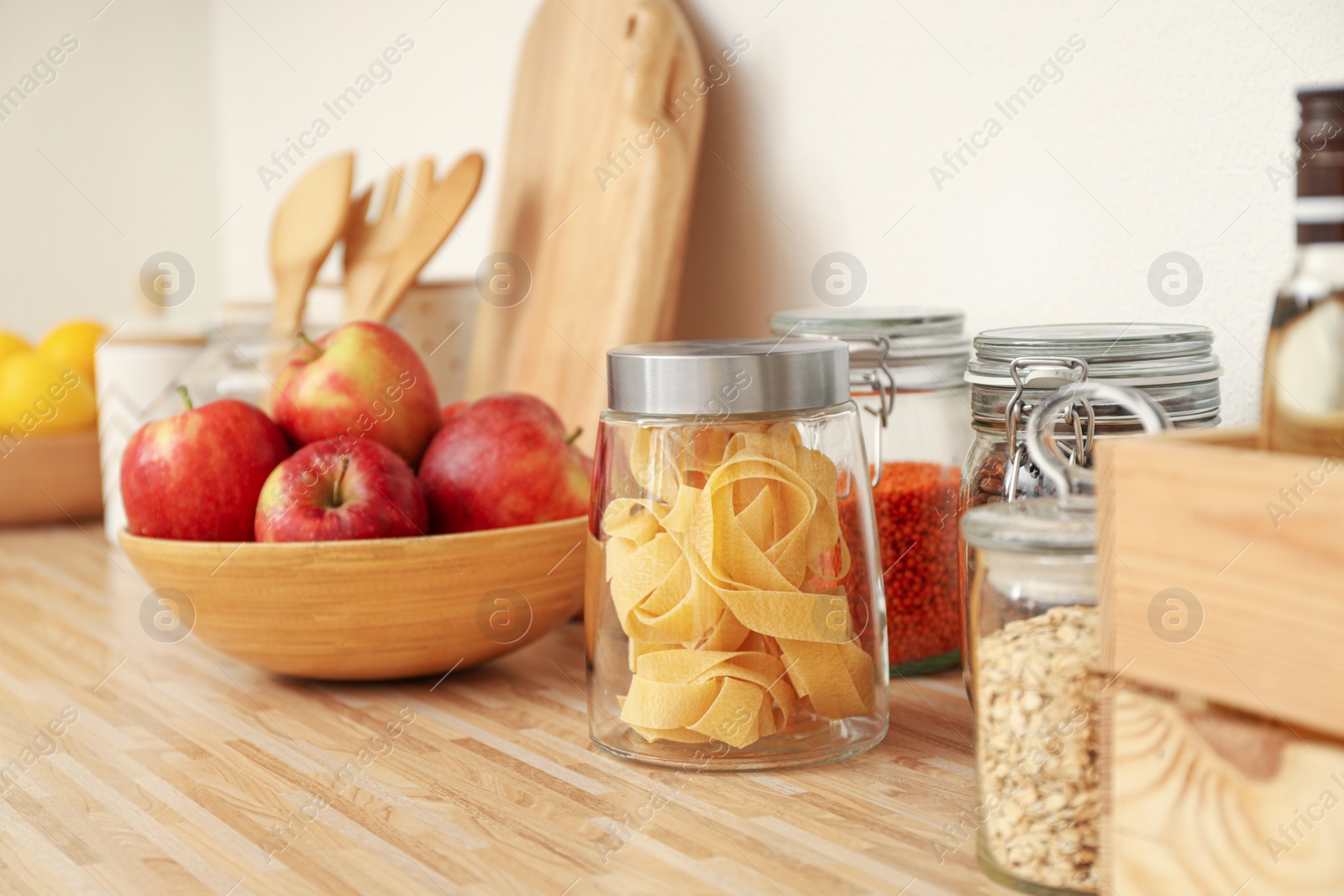 Photo of Different products on wooden countertop in kitchen