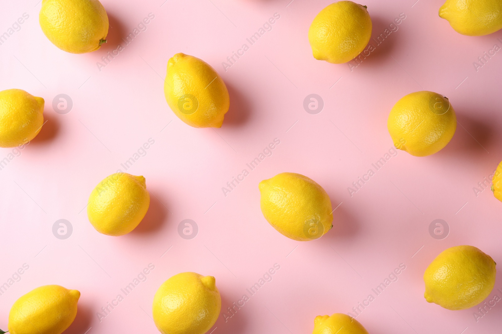 Photo of Flat lay composition with fresh ripe lemons on color background