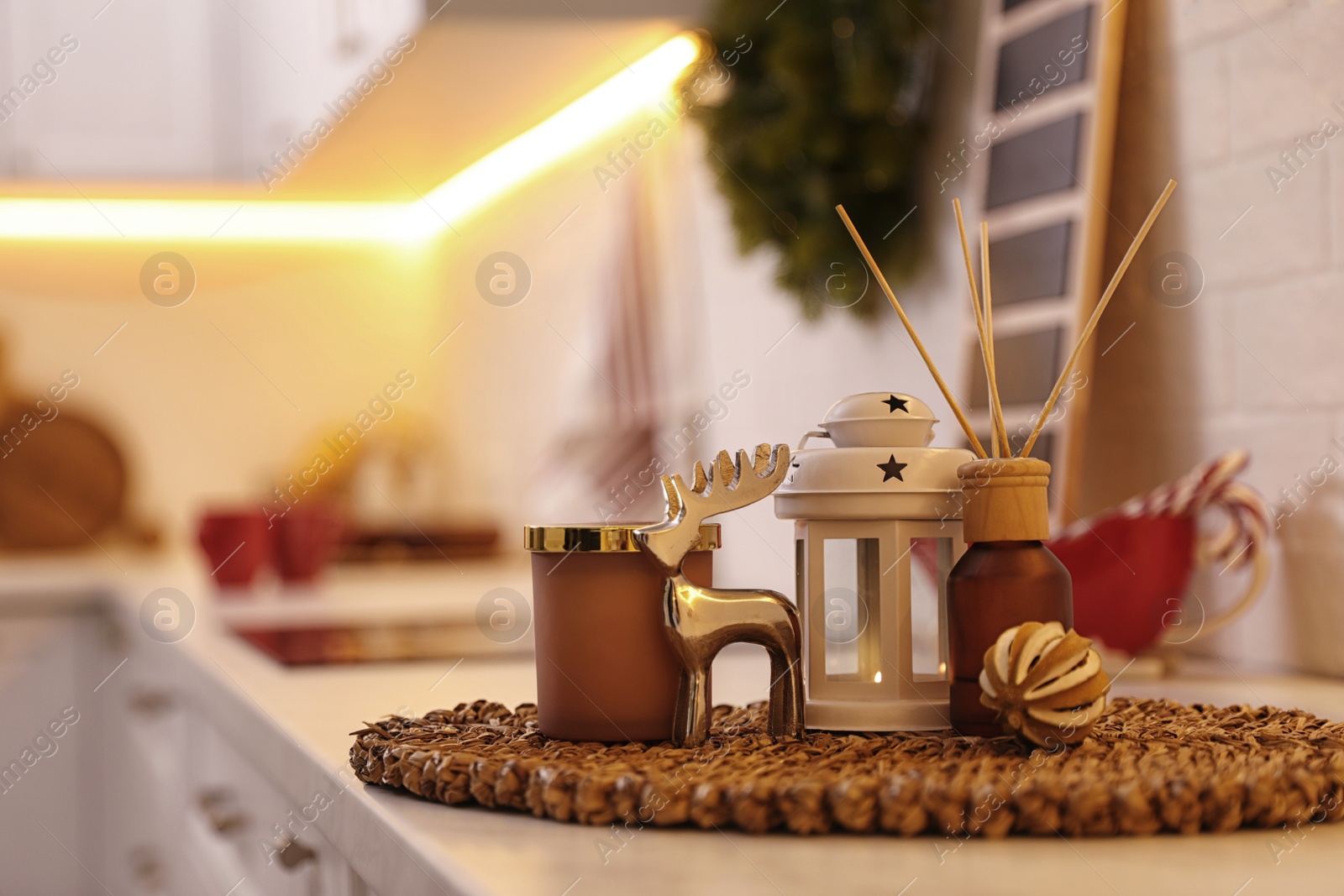 Photo of Composition with decorative reindeer and Christmas lantern on light table indoors, space for text