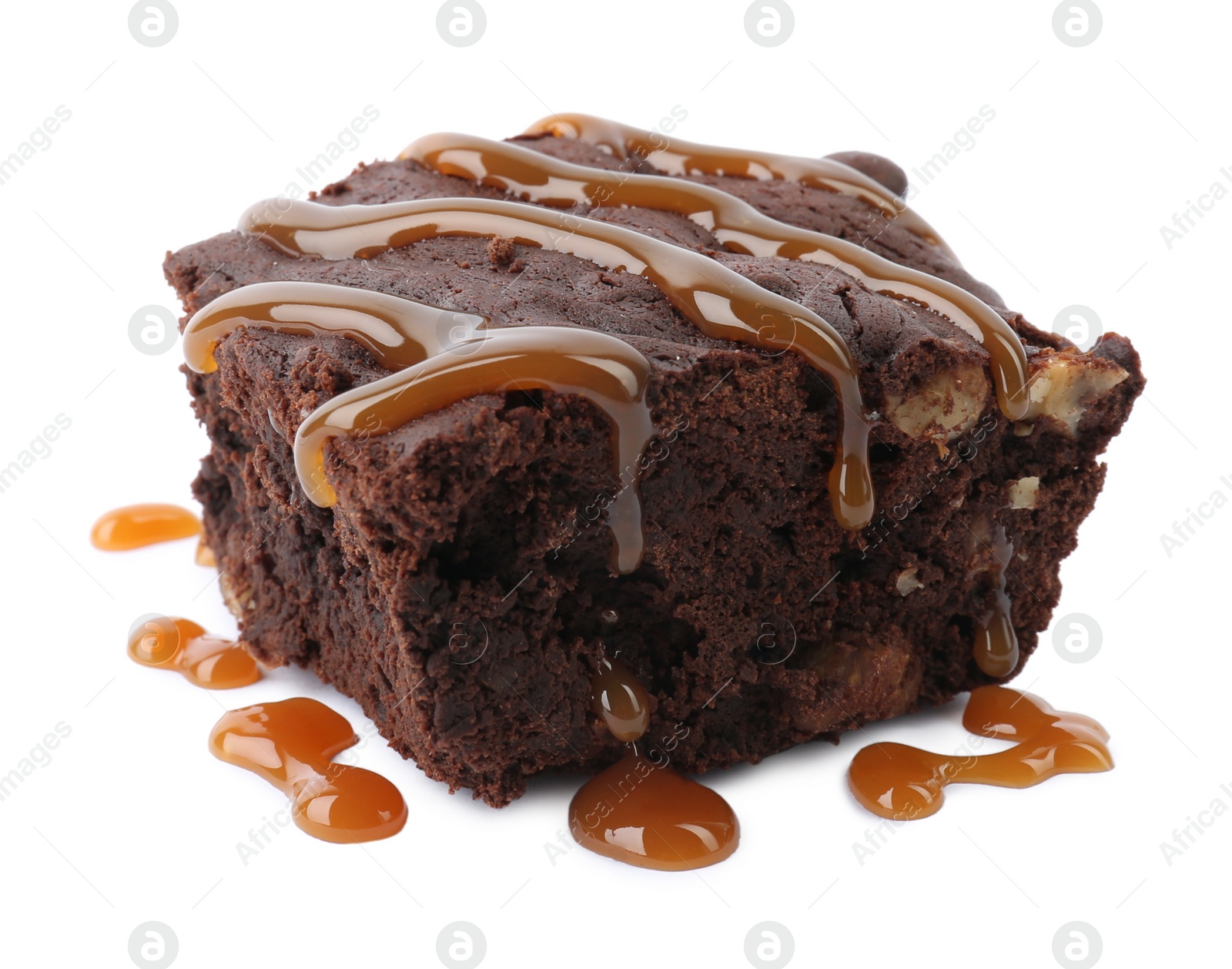 Photo of Delicious chocolate brownie with nuts and caramel sauce on white background