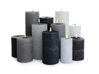 Set of different color candles on white background