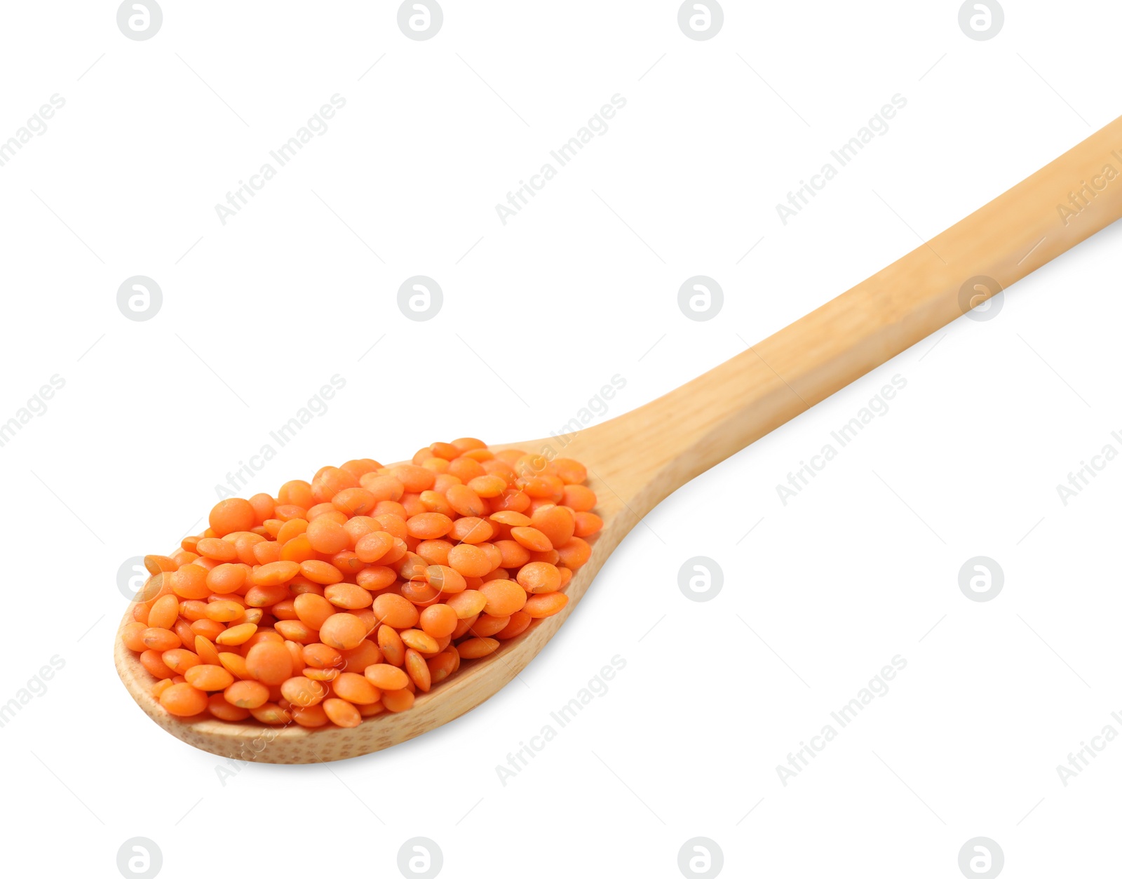 Photo of Wooden spoon with raw lentils isolated on white