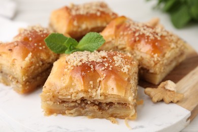 Eastern sweets. Pieces of tasty baklava on table, closeup