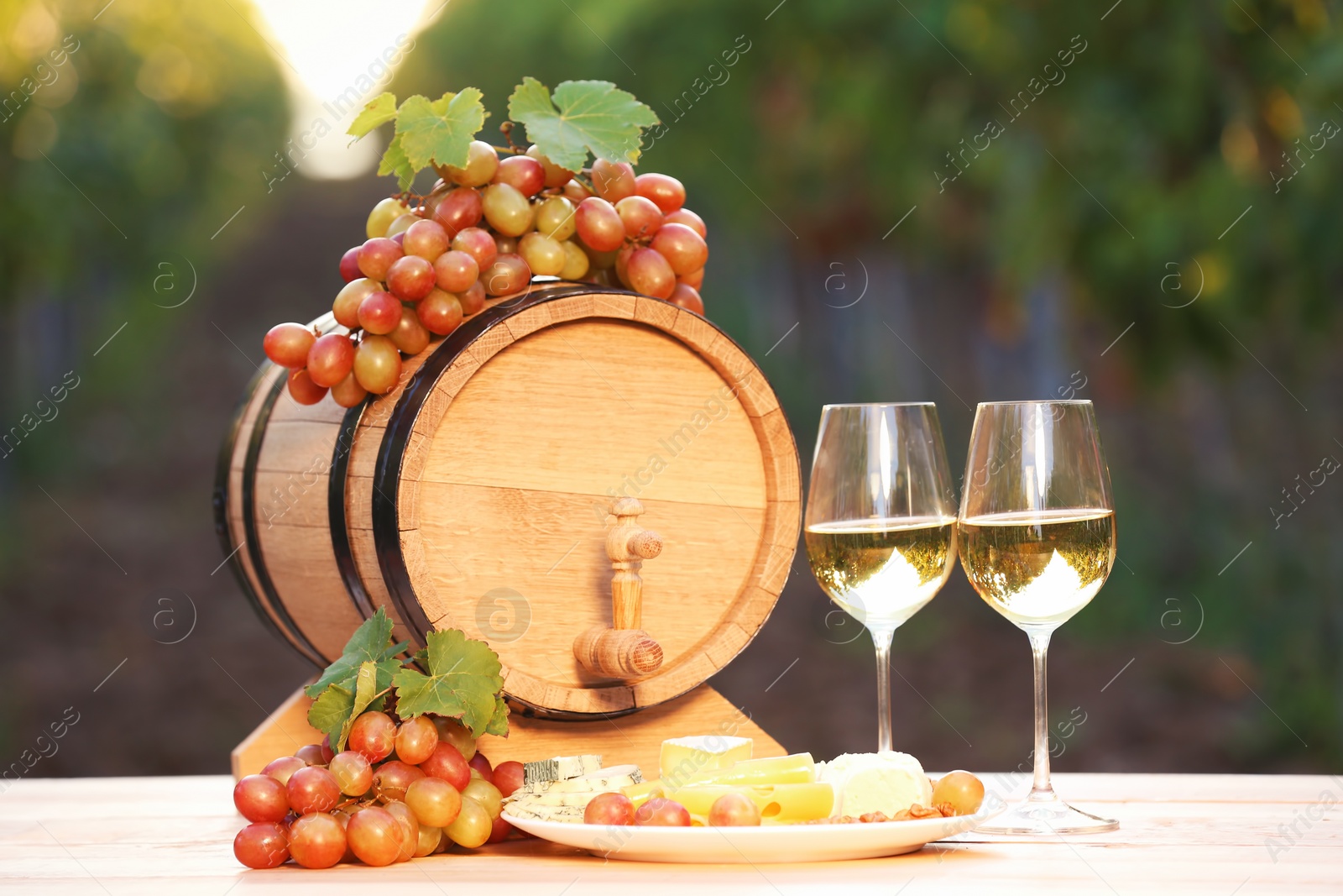 Photo of Composition with wine and snacks on table outdoors