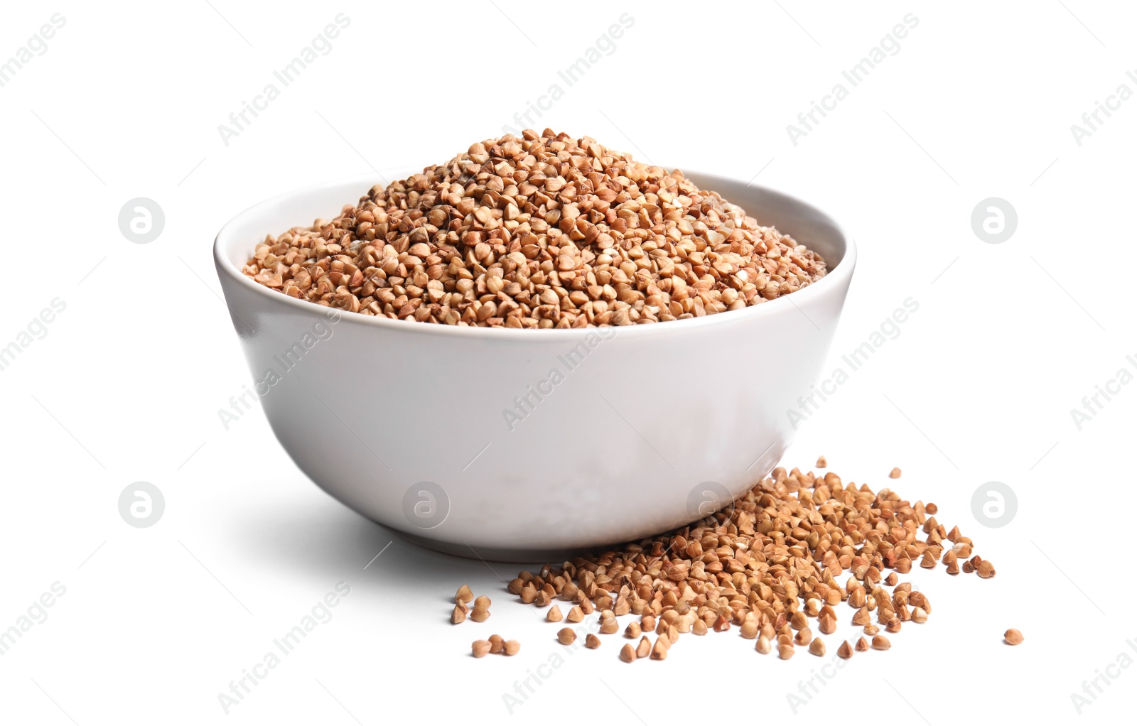 Photo of Bowl with uncooked buckwheat on white background