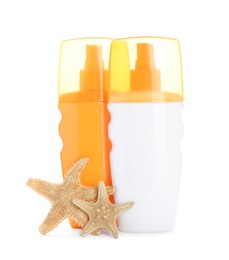 Different suntan products and starfishes on white background