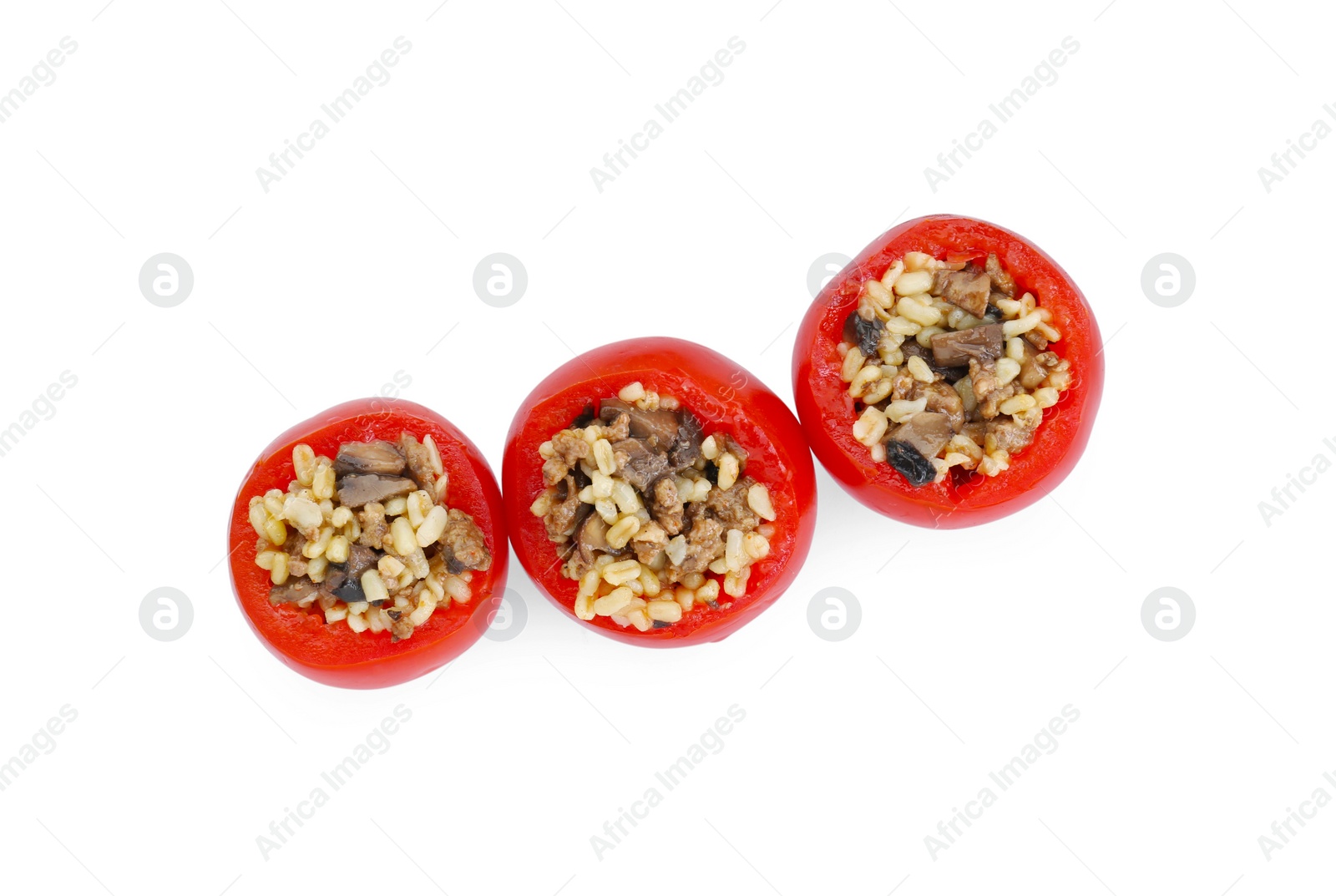 Photo of Delicious stuffed tomatoes with minced beef, bulgur and mushrooms isolated on white, top view