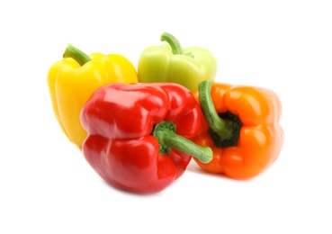 Fresh ripe bell peppers on white background