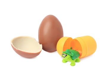 Slynchev Bryag, Bulgaria - May 24, 2023: Halves of Kinder Surprise Egg, plastic capsule and toy turtle isolated on white