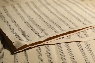 Photo of Many old note sheets as background, closeup