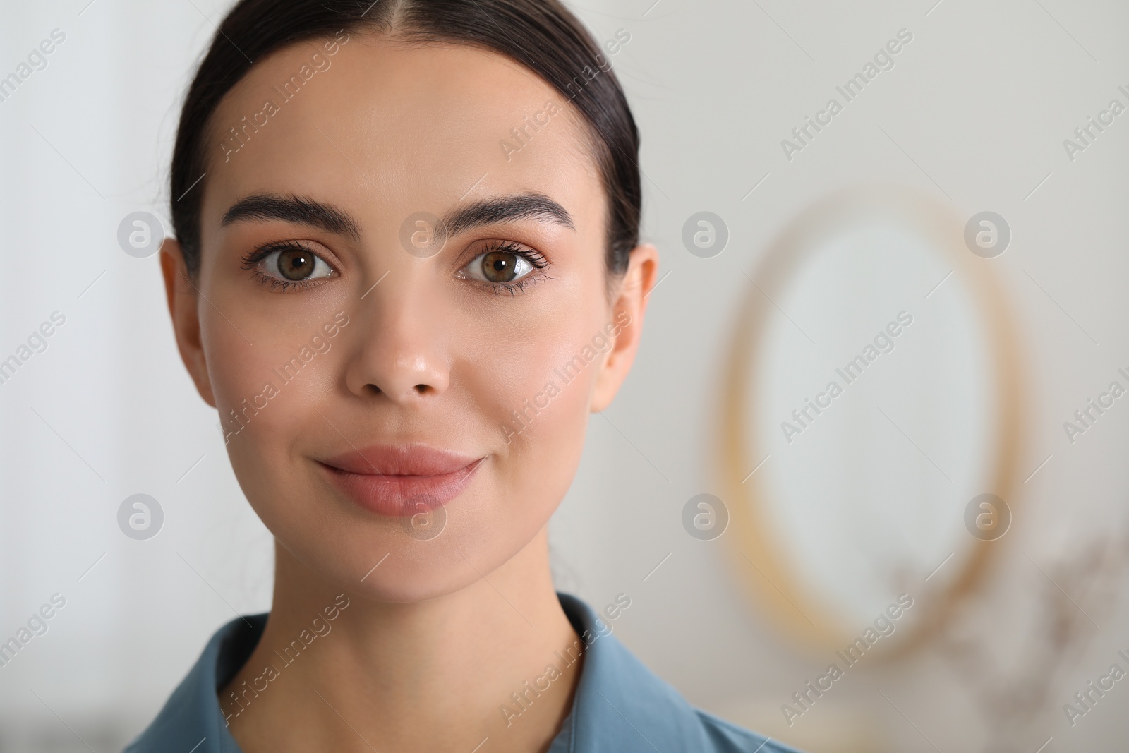 Photo of Portrait of beautiful young woman on blurred background. Space for text