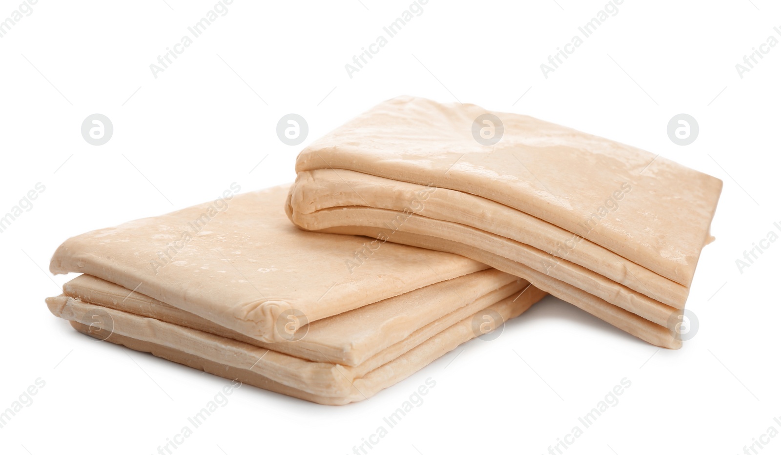 Photo of Fresh dough on white background. Puff pastry