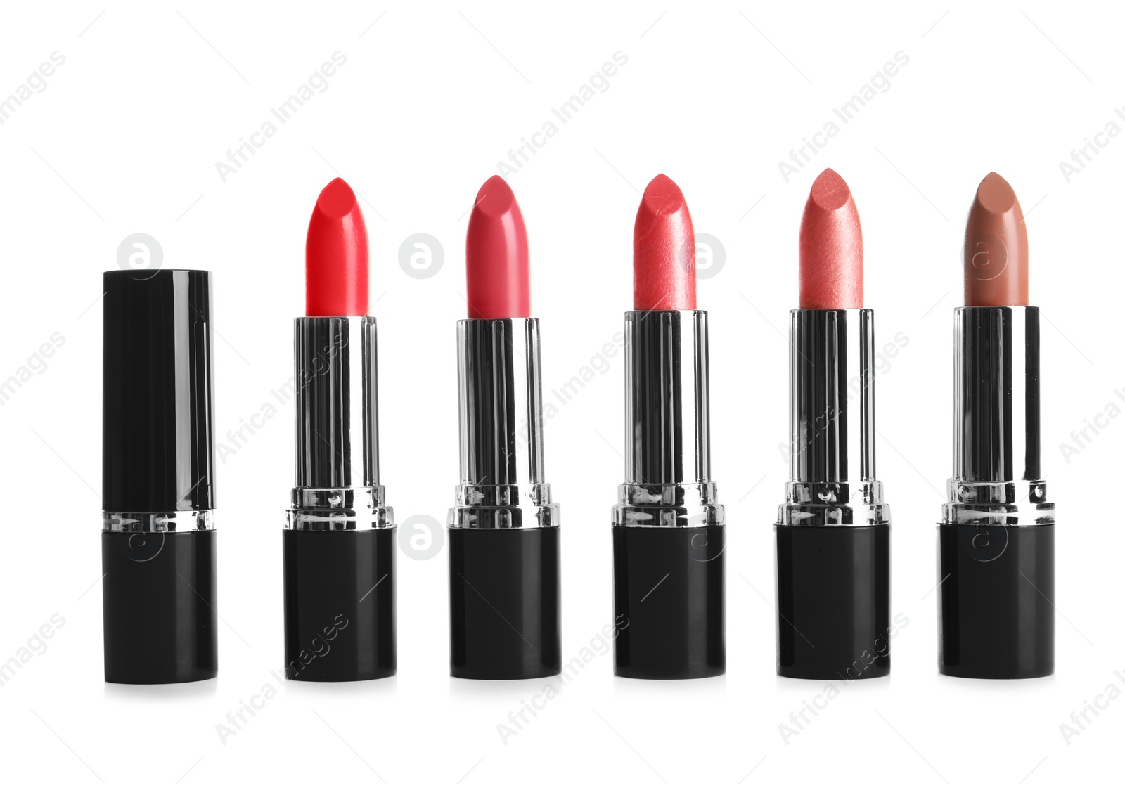 Photo of Different lipsticks on white background. Cosmetic product